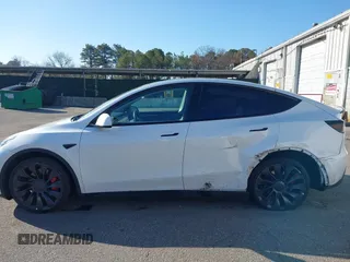 2023 Tesla Model Y Performance with VIN 7SAYGDEF3PF711497, listed as a IAAI auction lot 41877450 with 21,887 mi miles and . Bid and sale history available at DreamBid. Image 14.