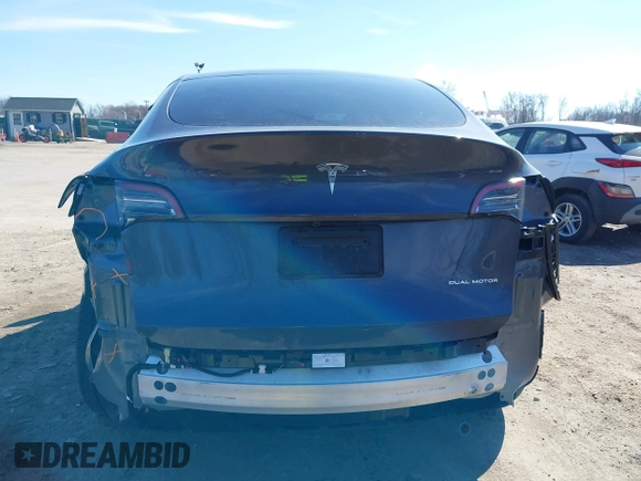 2023 Tesla Model Y Long Range with VIN 7SAYGDEE2PF883687, listed as a IAAI auction lot 41589837 with 36,890 mi miles. Bid and sale history available at carsss.com. Image 17.