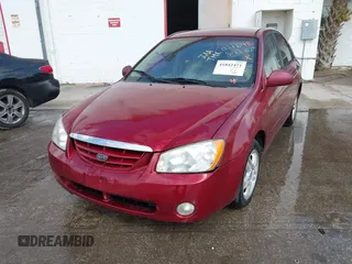 2004 Kia Spectra LX with VIN KNAFE121545021648, listed as a IAAI auction lot 41842471 with 211,436 mi miles. Bid and sale history available at carsss.com. Image 6.