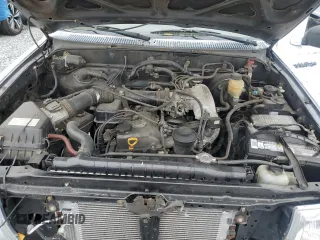 1999 Toyota Tacoma z VIN 4TAVL52N8XZ435689, wystawiony jako Copart lot #52162105 z przebiegiem 2 317 301 mil mil oraz Szkoda całkowita • Salvage title. Historia ofert i sprzedaży dostępna na DreamBid. Obrazek 11.