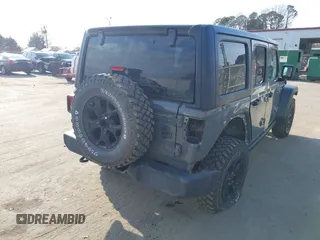 2022 Jeep Wrangler Unlimited Sport with VIN 1C4HJXDN7NW156538, listed as a IAAI auction lot 41526074 with 27,082 mi miles and . Bid and sale history available at DreamBid. Image 4.