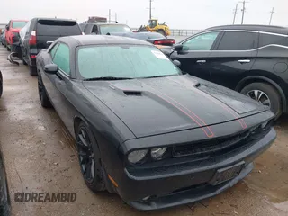 2014 Dodge Challenger R/T with VIN 2C3CDYBT1EH136717, listed as a IAAI auction lot 42198243 with 142,506 mi miles and . Bid and sale history available at DreamBid. Image 1.
