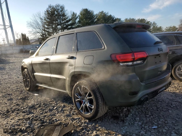 2021 Jeep Grand Cherokee SRT with VIN 1C4RJFDJ5MC718125, listed as a Copart auction lot 88736945 with 54,553 mi miles and Salvage Title. Bid and sale history available at carsss.com. Image 2.