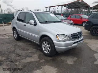 1999 Mercedes-Benz M-Class with VIN 4JGAB72E4XA113675, listed as a IAAI auction lot 41554604 with 230,092 mi miles. Bid and sale history available at carsss.com. Image 1.