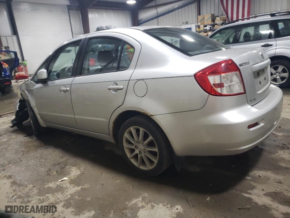 2011 Suzuki SX4 LE with VIN JS2YC5A21B6300076, listed as a Copart auction lot 83118734 with 213,177 mi miles and Salvage Title. Bid and sale history available at carsss.com. Image 2.