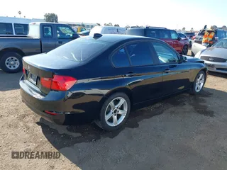 2013 BMW 3 Series 320i with VIN WBA3B1C57DF461779, listed as a IAAI auction lot 41991156 with 134,592 mi miles. Bid and sale history available at carsss.com. Image 4.
