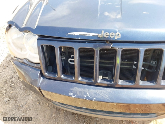 2010 Jeep Grand Cherokee Laredo with VIN 1J4PS4GK0AC112654, listed as a IAAI auction lot 41809445 with 418,301 mi miles. Bid and sale history available at carsss.com. Image 13.