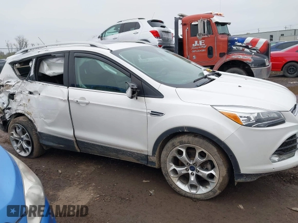 2016 Ford Escape Titanium with VIN 1FMCU9J94GUC22994, listed as a IAAI auction lot 42010816 with 80,293 mi miles. Bid and sale history available at carsss.com. Image 13.
