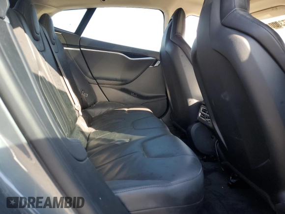 2013 Tesla Model S with VIN 5YJSA1CG9DFP09733, listed as a Copart auction lot 87739005 with 88,163 mi miles and Salvage title. Bid and sale history available at DreamBid. Image 10.