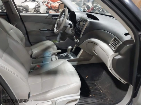 2013 Subaru Forester 2.5X Limited with VIN JF2SHAEC0DH439895, listed as a IAAI auction lot 42058386 with 218,414 mi miles. Bid and sale history available at carsss.com. Image 5.