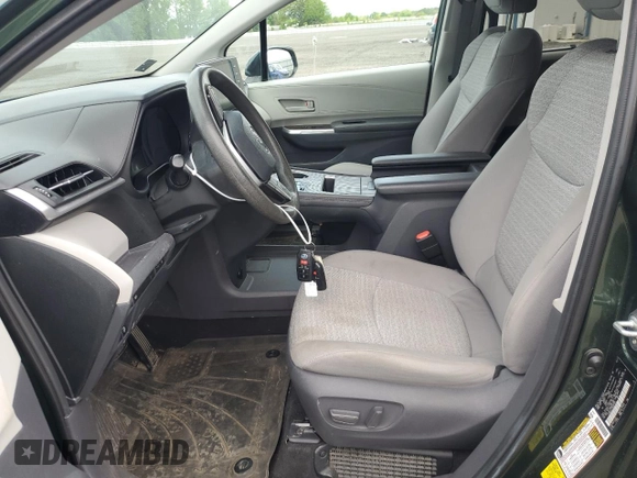 2021 Toyota Sienna LE with VIN 5TDBSKFC4MS027897, listed as a Copart auction lot 56052375 with 66,604 mi miles and Salvage title. Bid and sale history available at DreamBid. Image 7.