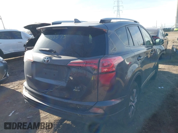 2016 Toyota RAV4 LE with VIN JTMBFREV1GJ085659, listed as a IAAI auction lot 41823575 with 141,657 mi miles. Bid and sale history available at carsss.com. Image 4.