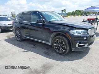 2016 BMW X5 xDrive50i with VIN 5UXKR6C51G0J81658, listed as a IAAI auction lot 41801382 with 34,572 mi miles. Bid and sale history available at carsss.com. Image 1.