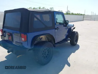 2010 Jeep Wrangler Sport with VIN 1J4AA2D11AL117404, listed as a IAAI auction lot 42012340 with 266,310 mi miles and . Bid and sale history available at carsss.com. Image 4.