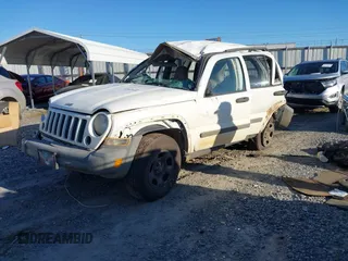 2005 Jeep Liberty Sport with VIN 1J4GK48KX5W679070, listed as a IAAI auction lot 41807899 with 157,726 mi miles. Bid and sale history available at carsss.com. Image 2.
