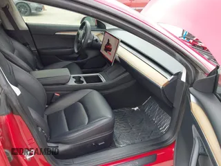 2023 Tesla Model 3 with VIN 5YJ3E1EA0PF455058, listed as a IAAI auction lot 42201618 with 31,147 mi miles and . Bid and sale history available at DreamBid. Image 5.