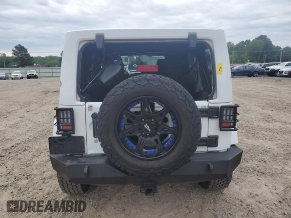 2012 Jeep Wrangler Unlimited Sahara with VIN 1C4HJWEG8CL126053, listed as a Copart auction lot 54363285 with 88,014 mi miles and Salvage title. Bid and sale history available at DreamBid. Image 6.