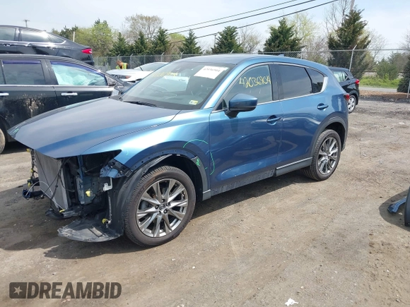2019 Mazda CX-5 Signature with VIN JM3KFBEY1K0512880, listed as a IAAI auction lot 42036904 with 92,650 mi miles. Bid and sale history available at carsss.com. Image 2.