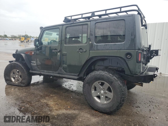 2012 Jeep Wrangler Unlimited Sport with VIN 1C4HJWDG8CL122067, listed as a Copart auction lot 58549805 with 124,658 mi miles and Clean title. Bid and sale history available at DreamBid. Image 2.