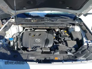 2020 Mazda CX-5 Touring with VIN JM3KFBCM0L0828207, listed as a IAAI auction lot 41305801 with 56,500 mi miles and . Bid and sale history available at DreamBid. Image 10.