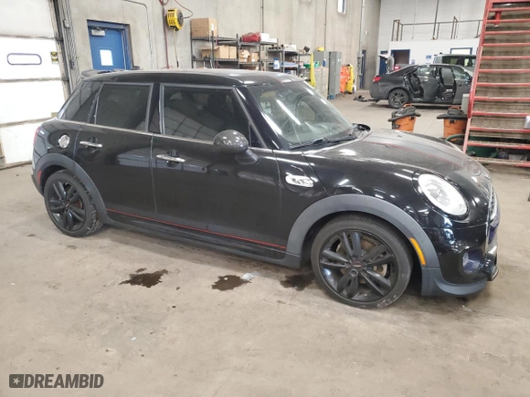 2016 MINI Cooper Hardtop 4 Door S with VIN WMWXU3C5XG2B63166, listed as a Copart auction lot 84016934 with 58,921 mi miles and Salvage Title. Bid and sale history available at carsss.com. Image 4.