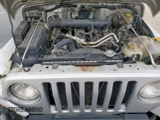 2004 Jeep Wrangler X z VIN 1J4FA39S34P702186, wystawiony jako Copart lot #59561675 z przebiegiem 202 214 mil mil oraz Szkoda całkowita • Salvage title. Historia ofert i sprzedaży dostępna na DreamBid. Obrazek 12.