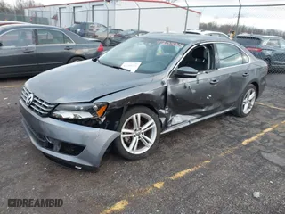 2014 Volkswagen Passat SE w/Sunroof with VIN 1VWBS7A32EC057808, listed as a IAAI auction lot 41208311 with 91,362 mi miles. Bid and sale history available at carsss.com. Image 2.