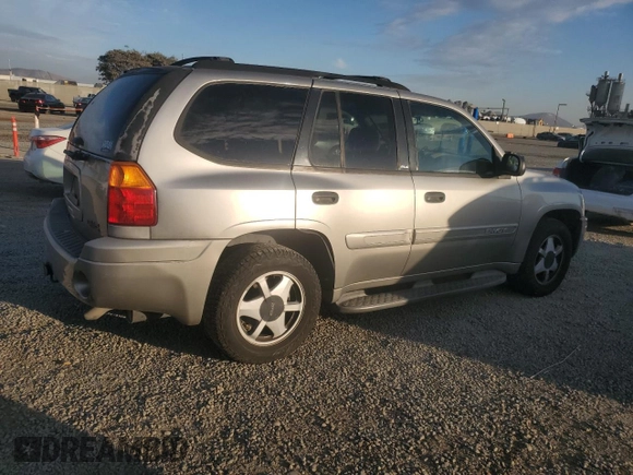 2002 GMC Envoy SLT with VIN 1GKDS13S922287249, listed as a Copart auction lot 88049875 with 157,485 mi miles and Salvage Title. Bid and sale history available at carsss.com. Image 3.