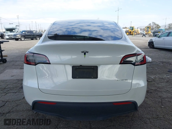 2023 Tesla Model Y Long Range with VIN 7SAYGAEE7PF607195, listed as a IAAI auction lot 41819147 with 74,694 mi miles. Bid and sale history available at carsss.com. Image 16.