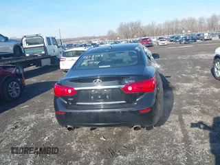 2015 Infiniti Q50 Premium z VIN JN1BV7AR9FM416956, wystawiony jako IAAI lot #41149753 z przebiegiem 81 888 mil mil oraz . Historia ofert i sprzedaży dostępna na DreamBid. Obrazek 16.
