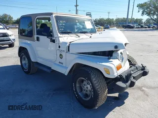 2001 Jeep Wrangler Sahara with VIN 1J4FA59S51P332107, listed as a IAAI auction lot 40954726 with 150,671 mi miles. Bid and sale history available at carsss.com. Image 1.