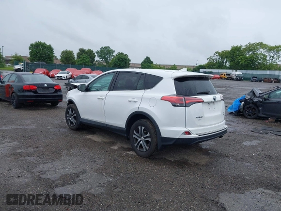 2018 Toyota RAV4 LE with VIN 2T3BFREV7JW851015, listed as a IAAI auction lot 42354042 with 94,603 mi miles and . Bid and sale history available at DreamBid. Image 3.