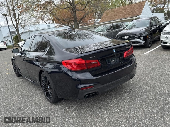 2018 BMW 5 Series M550i xDrive with VIN WBAJB9C57JB035521, listed as a Copart auction lot 54177125 with 63,924 mi miles and Clean Title. Bid and sale history available at carsss.com. Image 3.