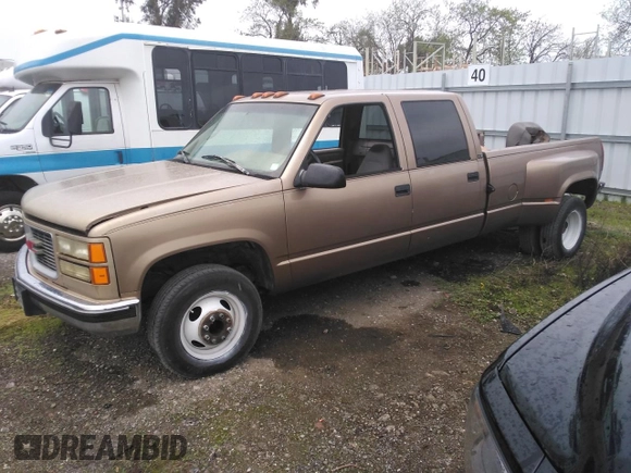 1996 GMC Sierra 1500 with VIN 1GTHC33J4TF010466, listed as a Copart auction lot 48392195 with 143,267 mi miles and Salvage Title. Bid and sale history available at DreamBid. Image 1.