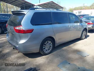 2015 Toyota Sienna XLE with VIN 5TDYK3DC0FS558486, listed as a IAAI auction lot 42064281 with 211,119 mi miles and . Bid and sale history available at DreamBid. Image 4.