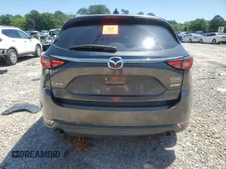 2018 Mazda CX-5 Grand Touring with VIN JM3KFADM9J0343621, listed as a Copart auction lot 52284475 with 129,776 mi miles and Salvage Title. Bid and sale history available at DreamBid. Image 6.