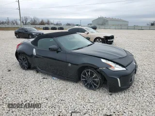 2014 Nissan 370Z Touring with VIN JN1AZ4FH1EM620177, listed as a Copart auction lot 42581255 with 106,957 mi miles and Salvage Title. Bid and sale history available at DreamBid. Image 4.