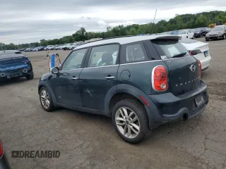 2014 MINI Countryman S with VIN WMWZC5C58EWP39797, listed as a Copart auction lot 62193515 with 84,989 mi miles and Salvage title. Bid and sale history available at DreamBid. Image 2.