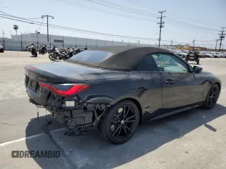 2022 BMW 4 Series M440i with VIN WBA53AT01NCJ52404, listed as a Copart auction lot 54464474 with 16,880 mi miles and Salvage title. Bid and sale history available at DreamBid. Image 3.