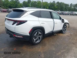 2022 Hyundai Tucson SEL z VIN 5NMJC3AE3NH057663, wystawiony jako IAAI lot #42428386 z przebiegiem 78 740 mil mil oraz . Historia ofert i sprzedaży dostępna na DreamBid. Obrazek 4.
