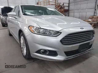 2013 Ford Fusion SE Hybrid z VIN 3FA6P0LU7DR228691, wystawiony jako IAAI lot #42055540 z przebiegiem 144 389 mil mil oraz . Historia ofert i sprzedaży dostępna na DreamBid. Obrazek 1.