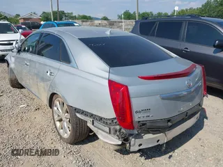 2013 Cadillac XTS Luxury z VIN 2G61R5S38D9228339, wystawiony jako IAAI lot #42664948 z przebiegiem 105 917 mil mil oraz . Historia ofert i sprzedaży dostępna na DreamBid. Obrazek 3.