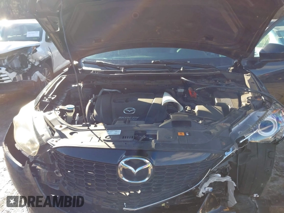 2014 Mazda CX-5 Grand Touring with VIN JM3KE4DY1E0303658, listed as a IAAI auction lot 41536769 with 158,777 mi miles. Bid and sale history available at carsss.com. Image 9.