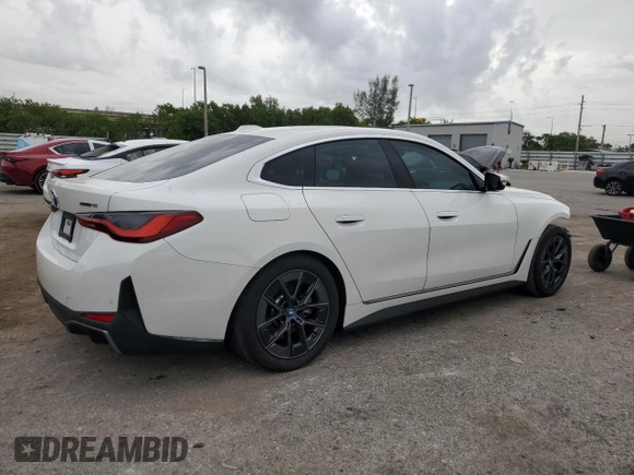 2023 BMW i4 eDrive40 with VIN WBY73AW0XPFN60228, listed as a Copart auction lot 61875624 with 21,597 mi miles and Salvage Title. Bid and sale history available at carsss.com. Image 3.