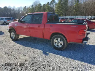 2002 Ford F-150 XLT with VIN 1FTRW08L92KD88745, listed as a Copart auction lot 41397555 with 211,116 mi miles and Salvage Title. Bid and sale history available at carsss.com. Image 2.