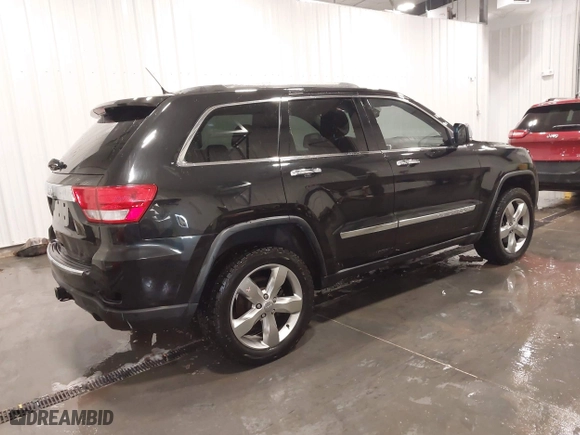 2011 Jeep Grand Cherokee Overland with VIN 1J4RR6GT7BC607735, listed as a IAAI auction lot 41830669 with 98,161 mi miles. Bid and sale history available at carsss.com. Image 4.