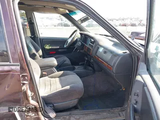 1996 Jeep Grand Cherokee Laredo with VIN 1J4GZ58S2TC262980, listed as a IAAI auction lot 41949514 with 269,674 mi miles and . Bid and sale history available at DreamBid. Image 5.