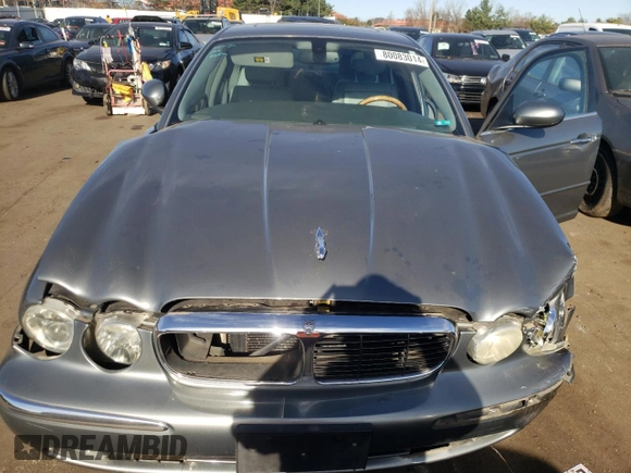 2004 Jaguar XJ with VIN SAJWA71C74SG34056, listed as a Copart auction lot 80083014 with 0 mi miles and Salvage Title. Bid and sale history available at carsss.com. Image 13.