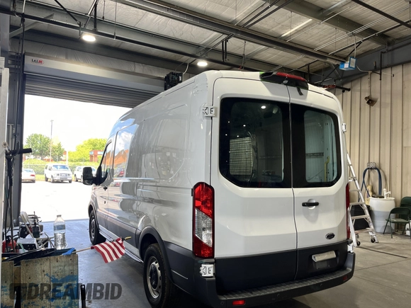 2018 Ford Transit with VIN 1FTYE1CM6JKB31142, listed as a IAAI auction lot 42785382 with 79,664 mi miles and . Bid and sale history available at DreamBid. Image 7.