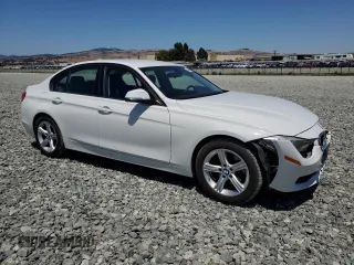 2014 BMW 3 Series 320i with VIN WBA3B1C55EK133687, listed as a Copart auction lot 63049945 with 95,604 mi miles and Salvage title. Bid and sale history available at DreamBid. Image 4.